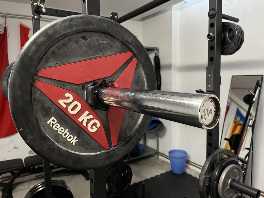 real life home gym with barbell closeup